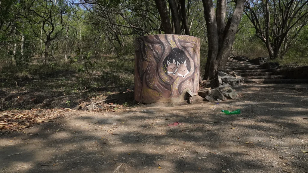 Painted animal target on a round bale at a woodland archery course