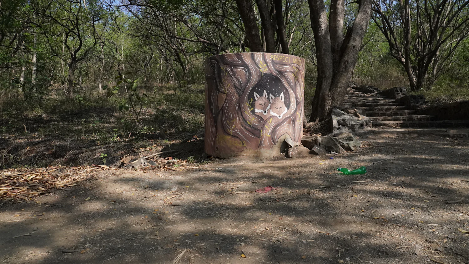 Painted animal target on a round bale at a woodland archery course